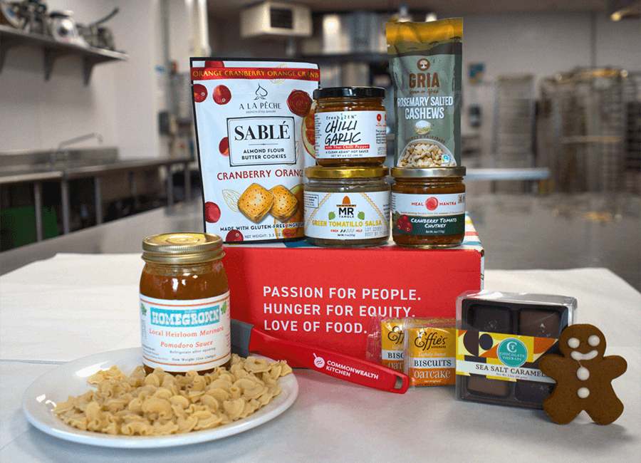 A variety of local food items, include pasta, condiments, and pantry staples, are displayed.